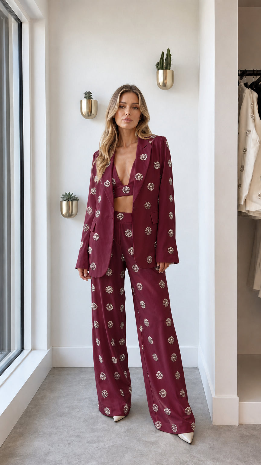 Front view of woman wearing burgundy rhinestone embellished blazer set