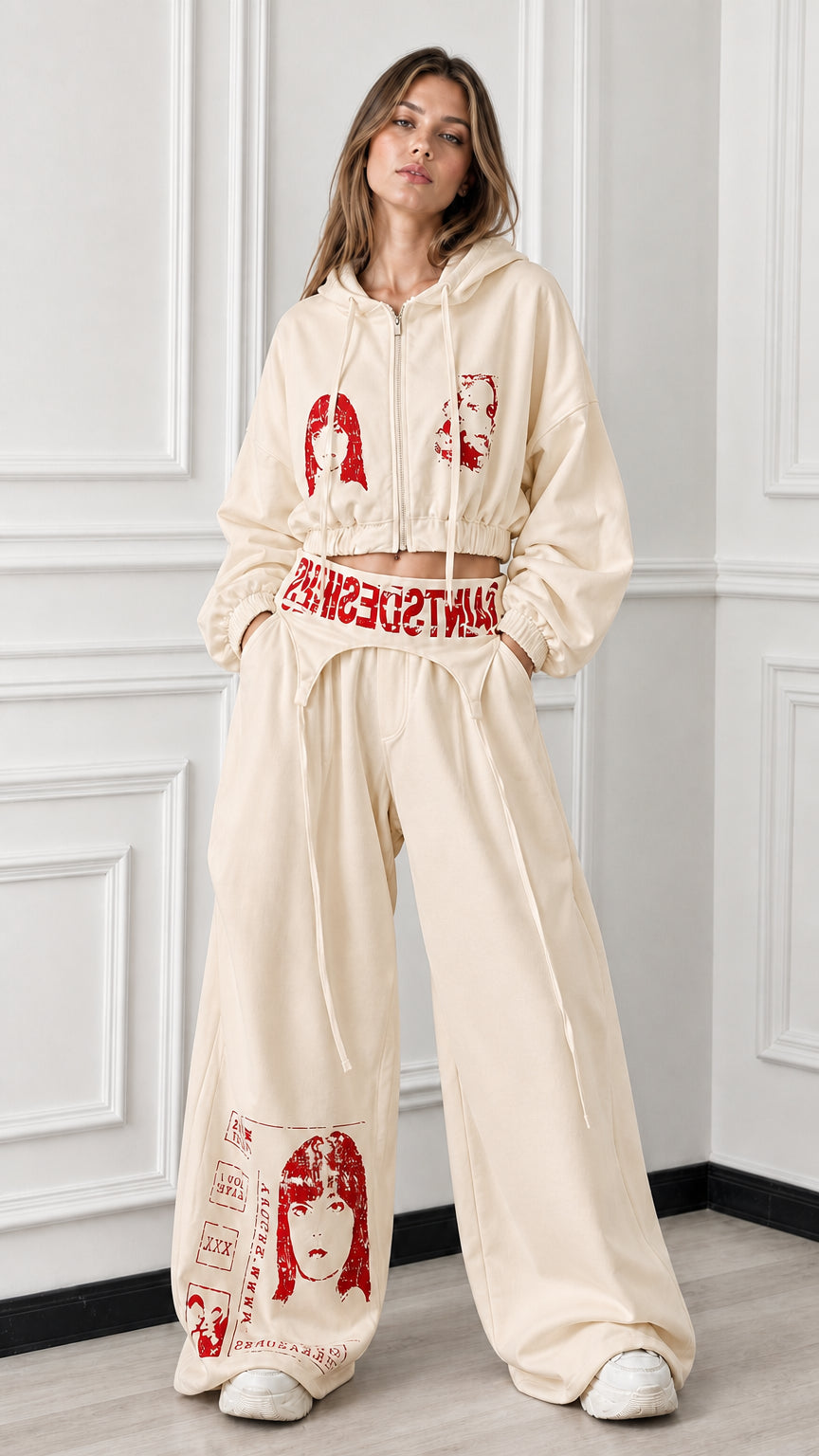 Full front view of beige cream 2-piece cropped zip hoodie and wide-leg graphic sweatpants set