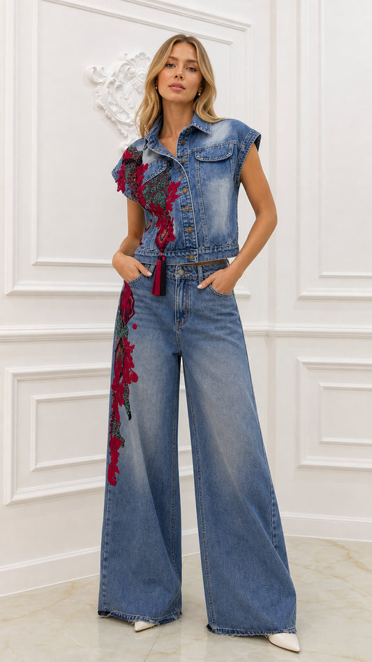 Front view of model wearing blue embroidered denim vest and wide-leg pants set