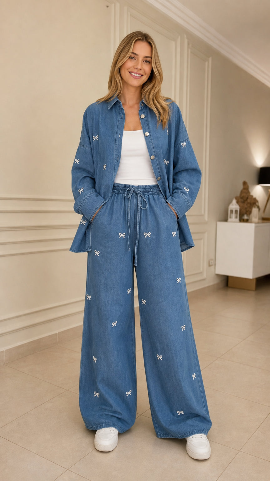 Woman wearing blue bow embroidered denim shirt and wide leg pants set front view