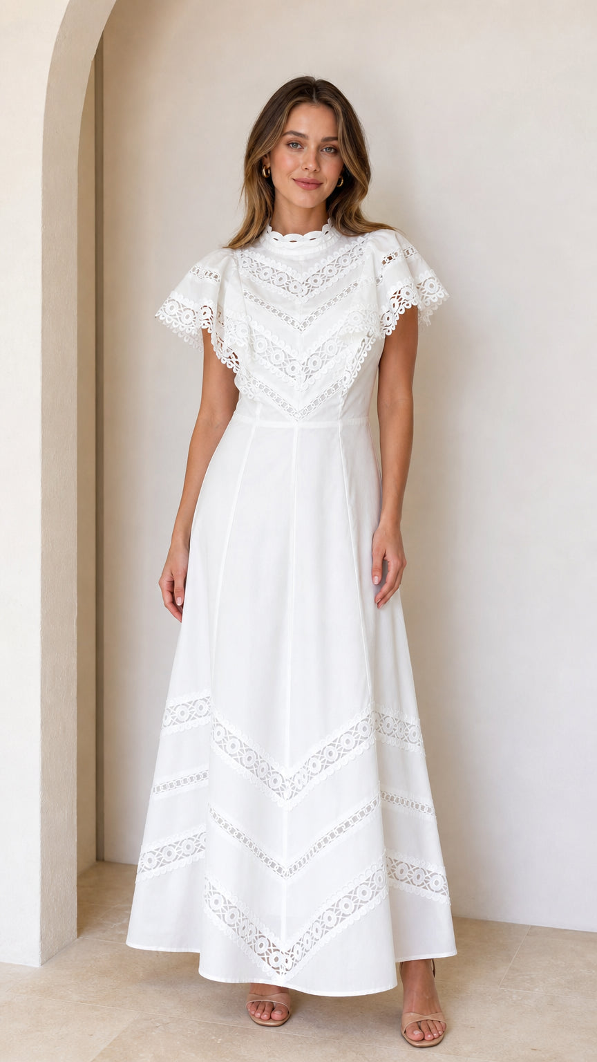 Front full-length view of white lace trim flutter sleeve maxi dress