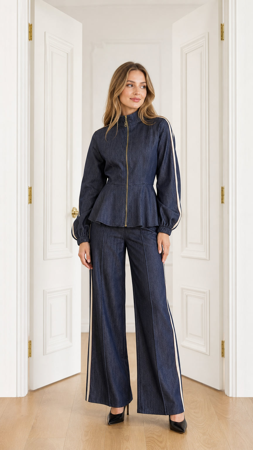 Front full-length view of model wearing Navy Blue peplum zip jacket and matching wide-leg trousers with side stripes