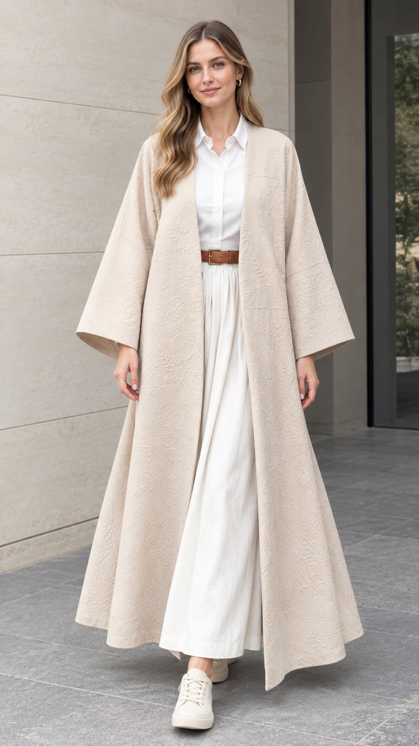 Front full-length view of woman wearing beige textured jacquard maxi duster kimono