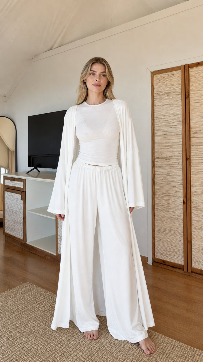 Front view of model wearing White 3-piece cardigan, fitted top, and wide-leg lounge pants set