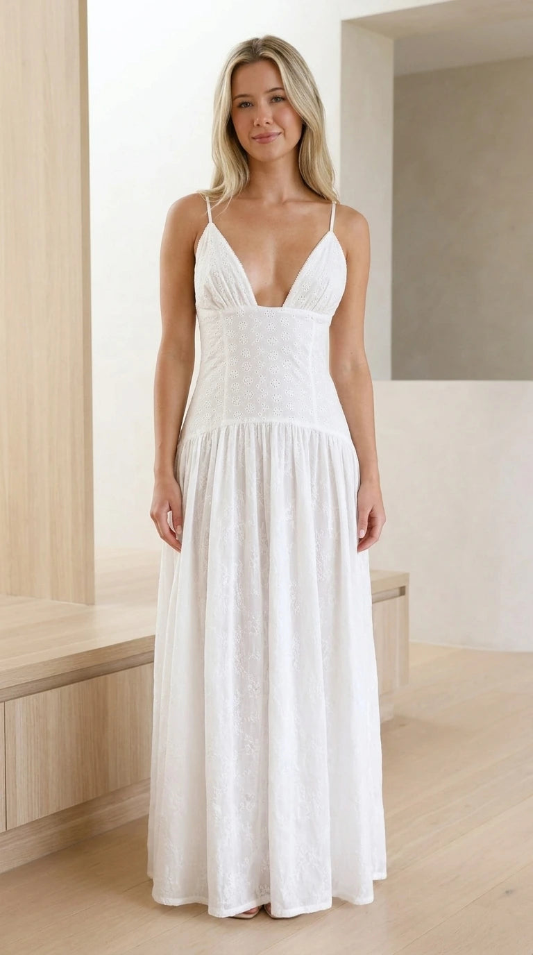 Front view of model wearing white eyelet drop-waist plunge maxi dress