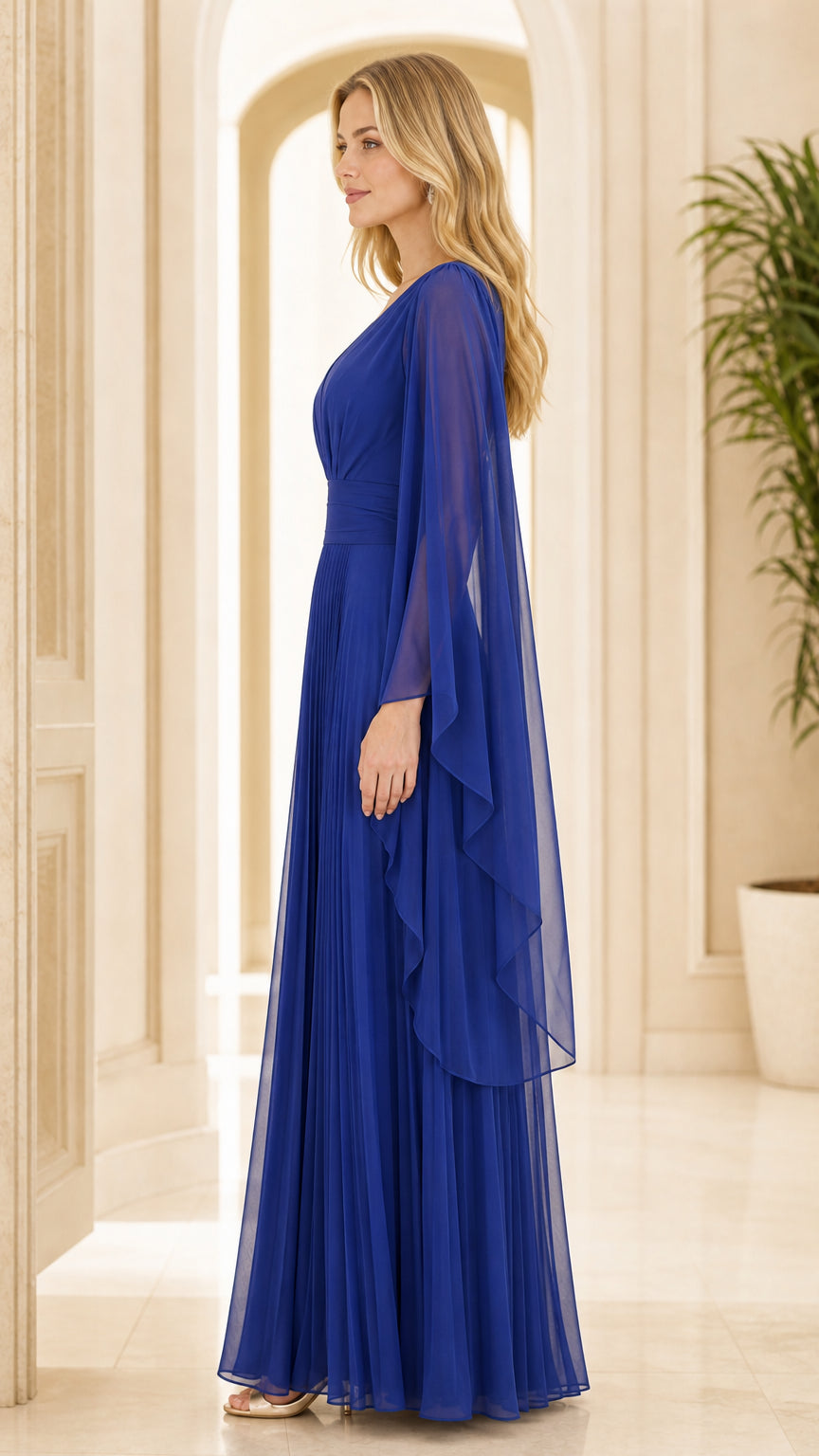 Side profile of woman in royal blue cape sleeve pleated maxi dress