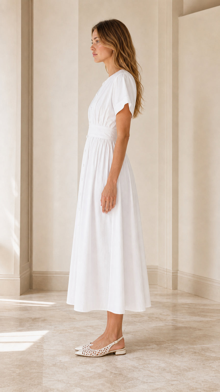 Side profile of white short sleeve pleated midi dress