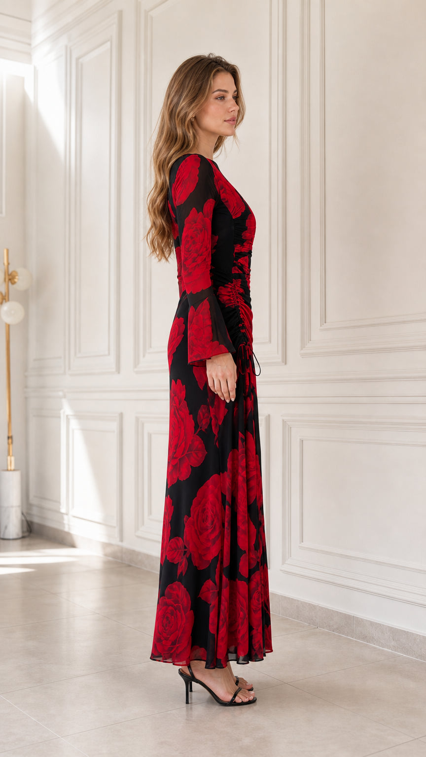 Side profile view of black floral print maxi dress