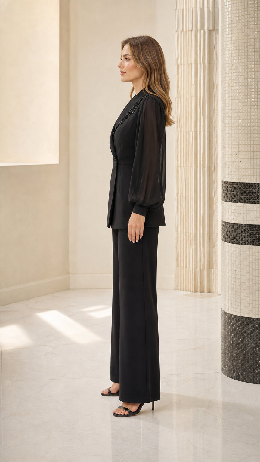 Side profile view of black pantsuit