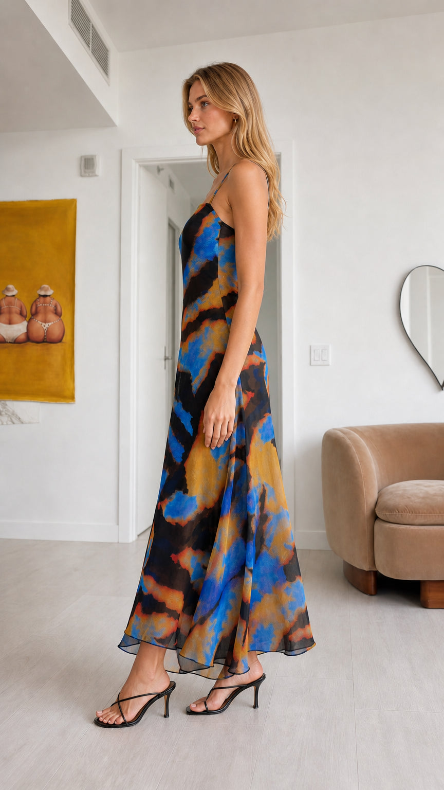 Side profile view of model wearing Black Multi chiffon two-piece set with flowy pants