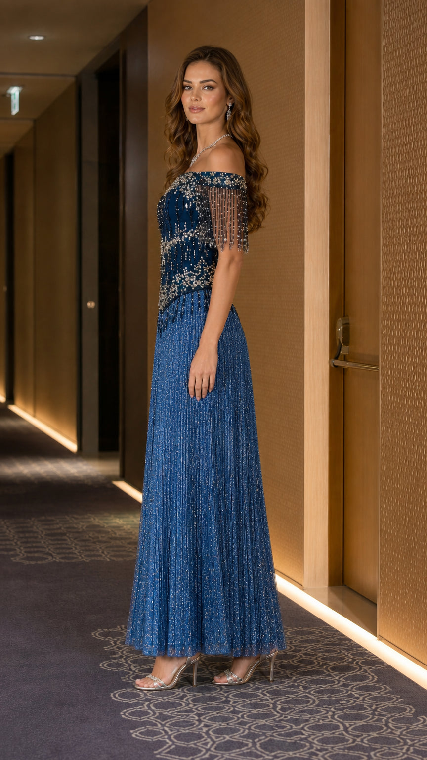 Side profile of blue evening gown with pleated skirt