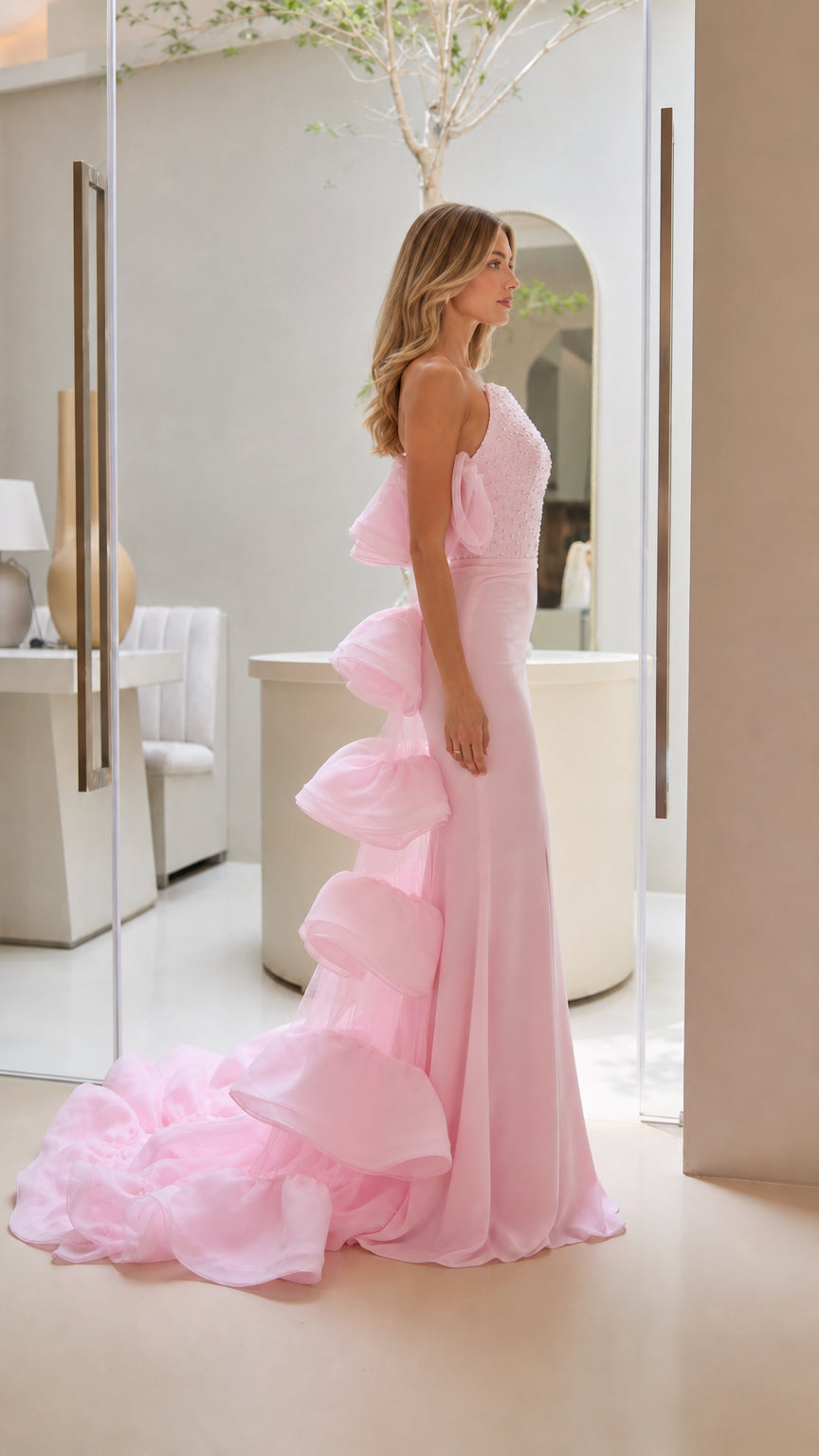 Side profile view of the pink evening gown showing fit and train