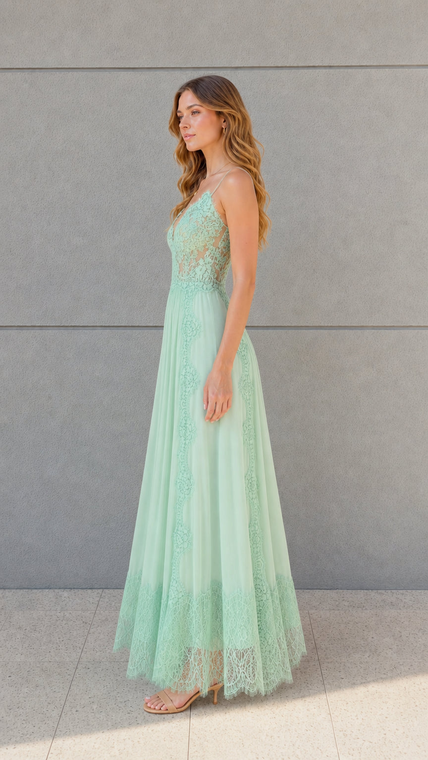 Side angle view of mint green lace bodice pleated maxi dress