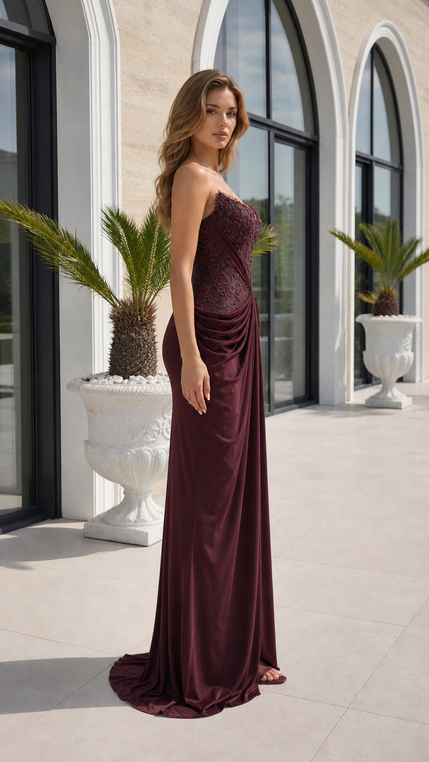 Side profile view of burgundy evening dress