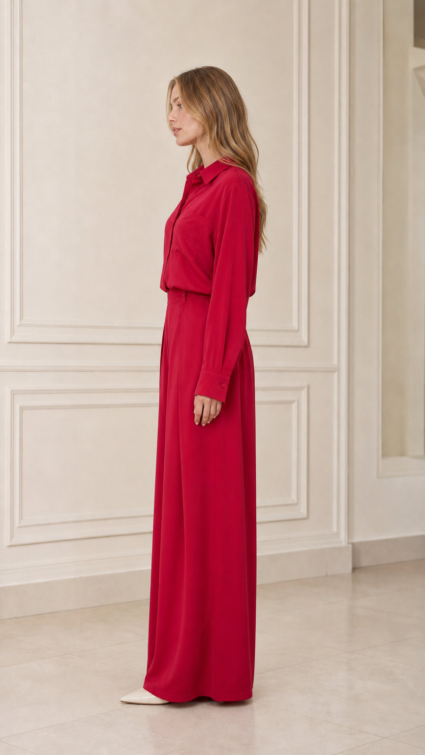 Side profile of model in red two-piece matching set