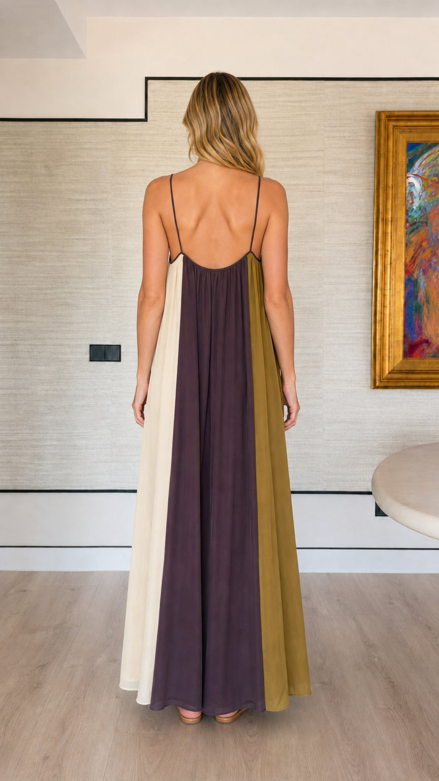 Back view showing the scoop back and slim straps of the color-block maxi dress