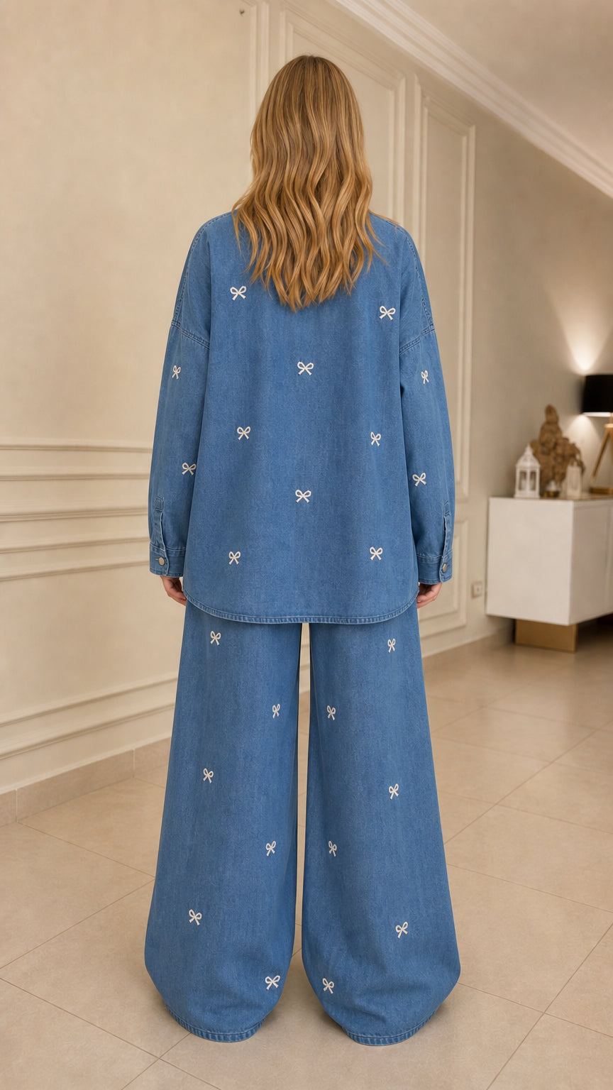 Woman wearing blue bow embroidered denim set back view