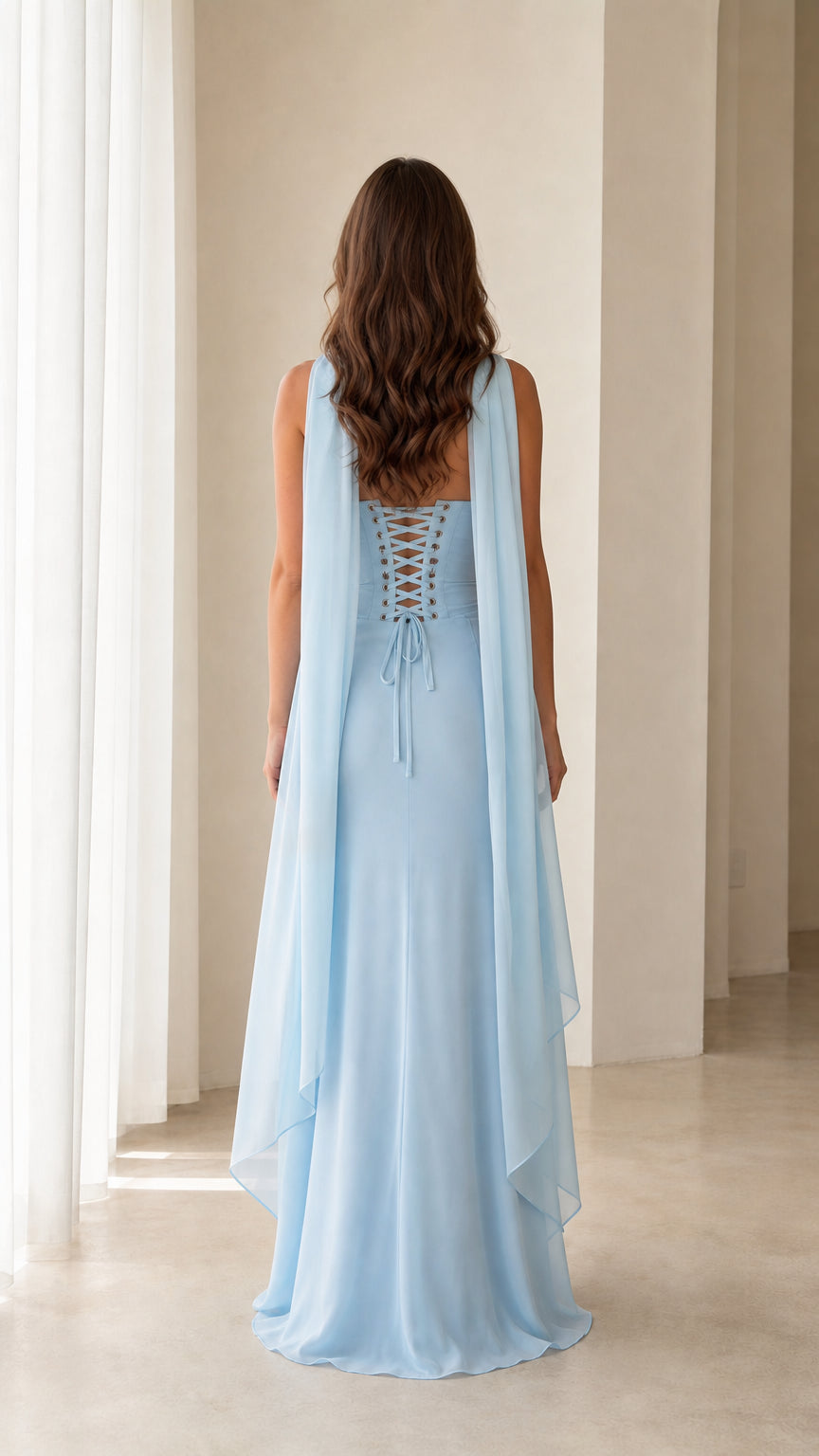 Back view of Sky Blue gown showing the lace-up corset and flowing back drape