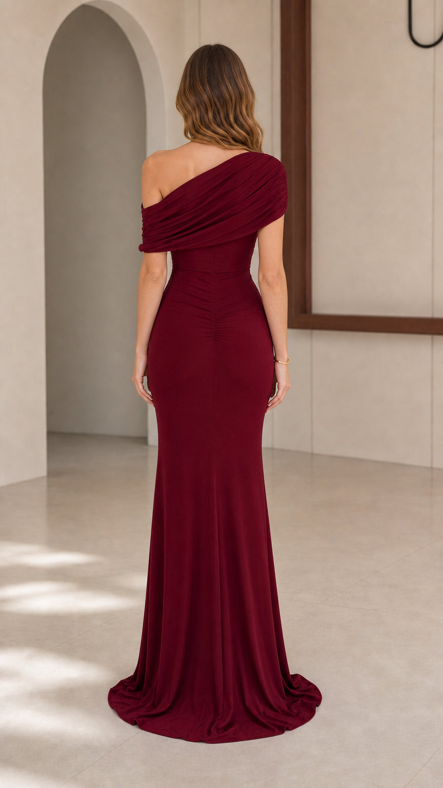 Model wearing Burgundy one-shoulder evening gown, back view