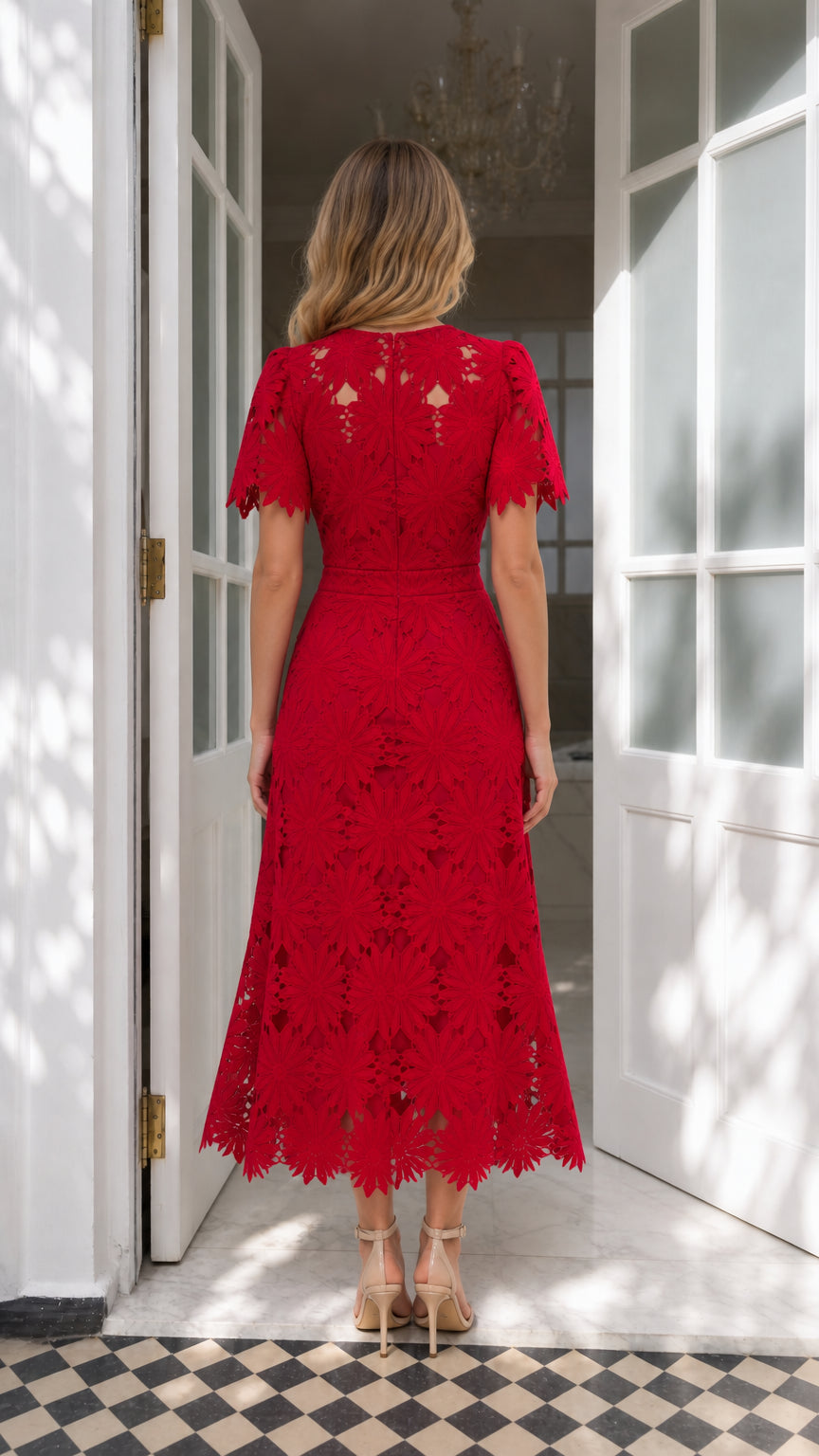 Back view of red lace midi dress showcasing fitted bodice and midi length