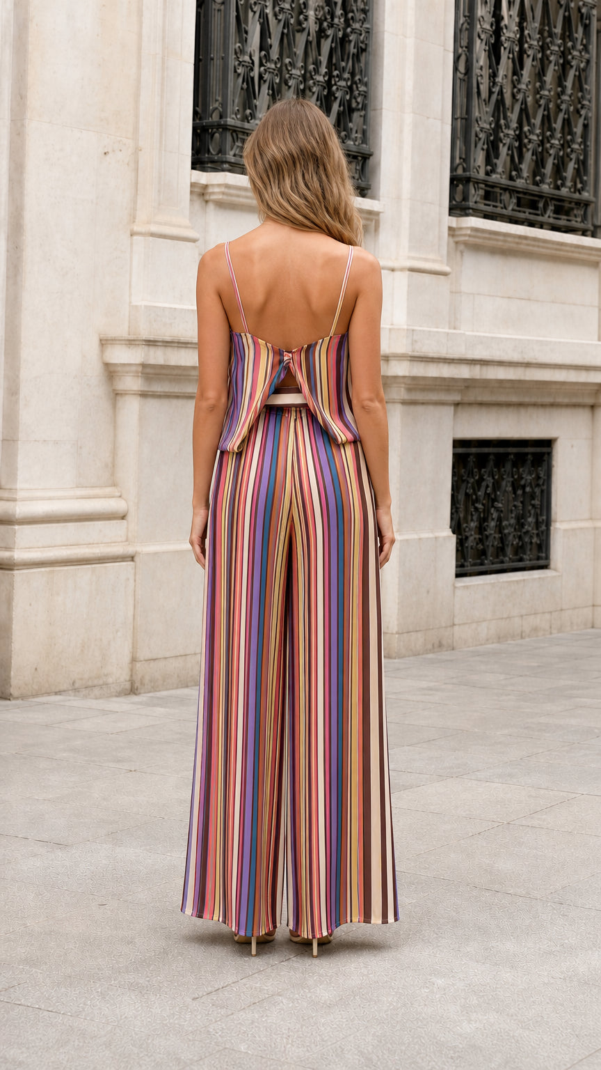 Back view of model wearing Multicolor Stripe wide leg jumpsuit showing split overlay
