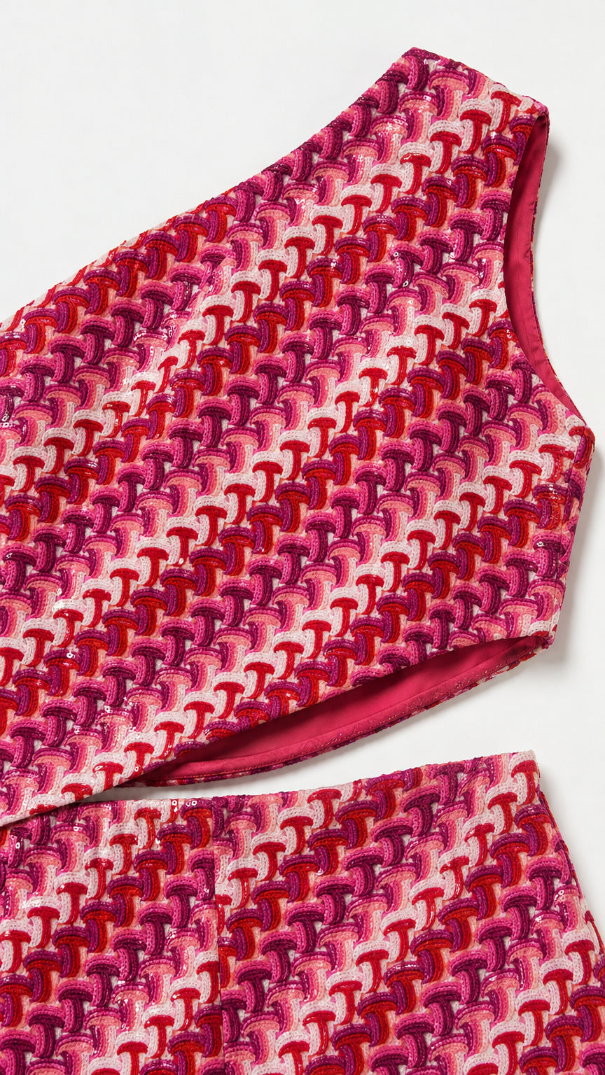 Close-up detail of fabric, neckline, and waist cutout