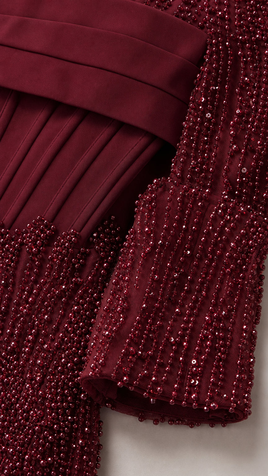 Close-up of the beadwork texture and structured bodice overlay