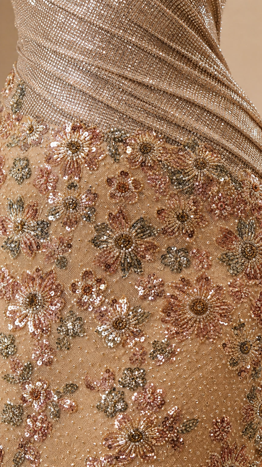 Close-up of diagonal pleated bodice and intricate floral sequin embroidery