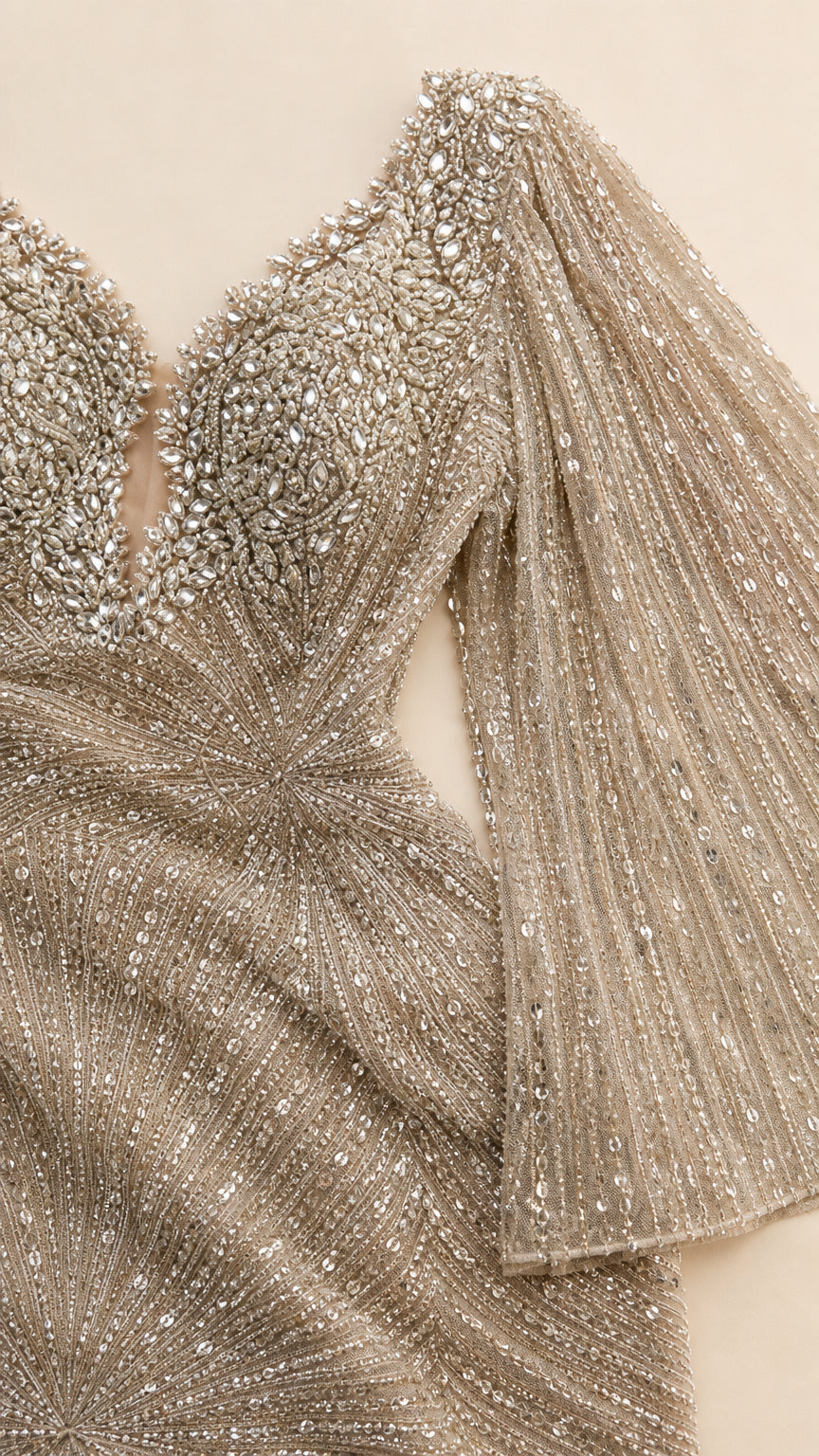 Close-up detail of shimmering sequin and crystal beadwork on deep neckline and bodice