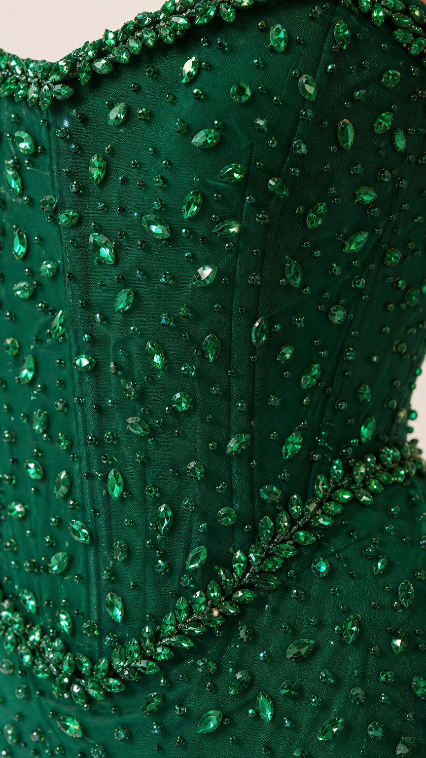 Close-up detail of green beadwork and embellishments