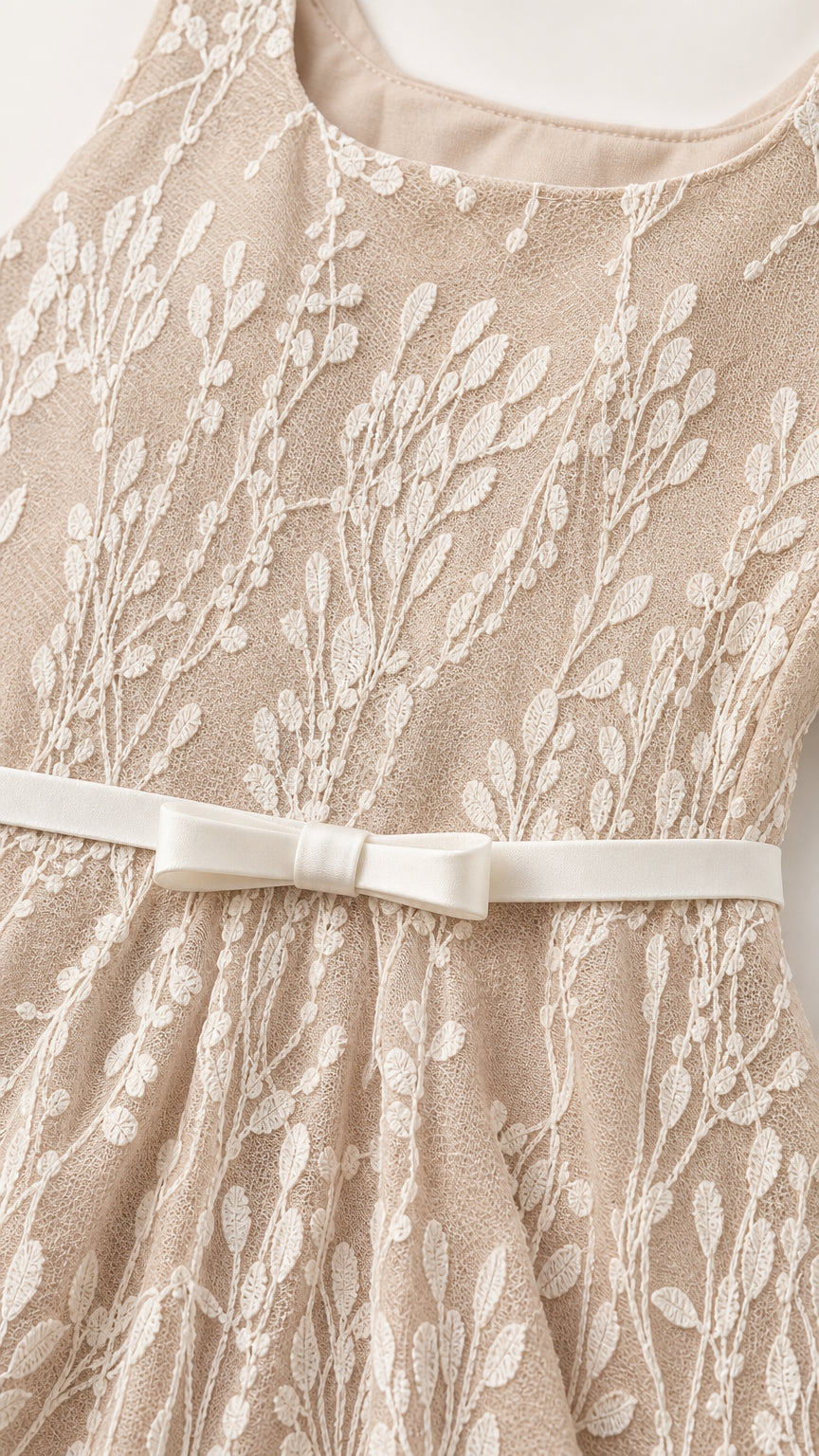 Close-up detail of lace texture and waist bow belt