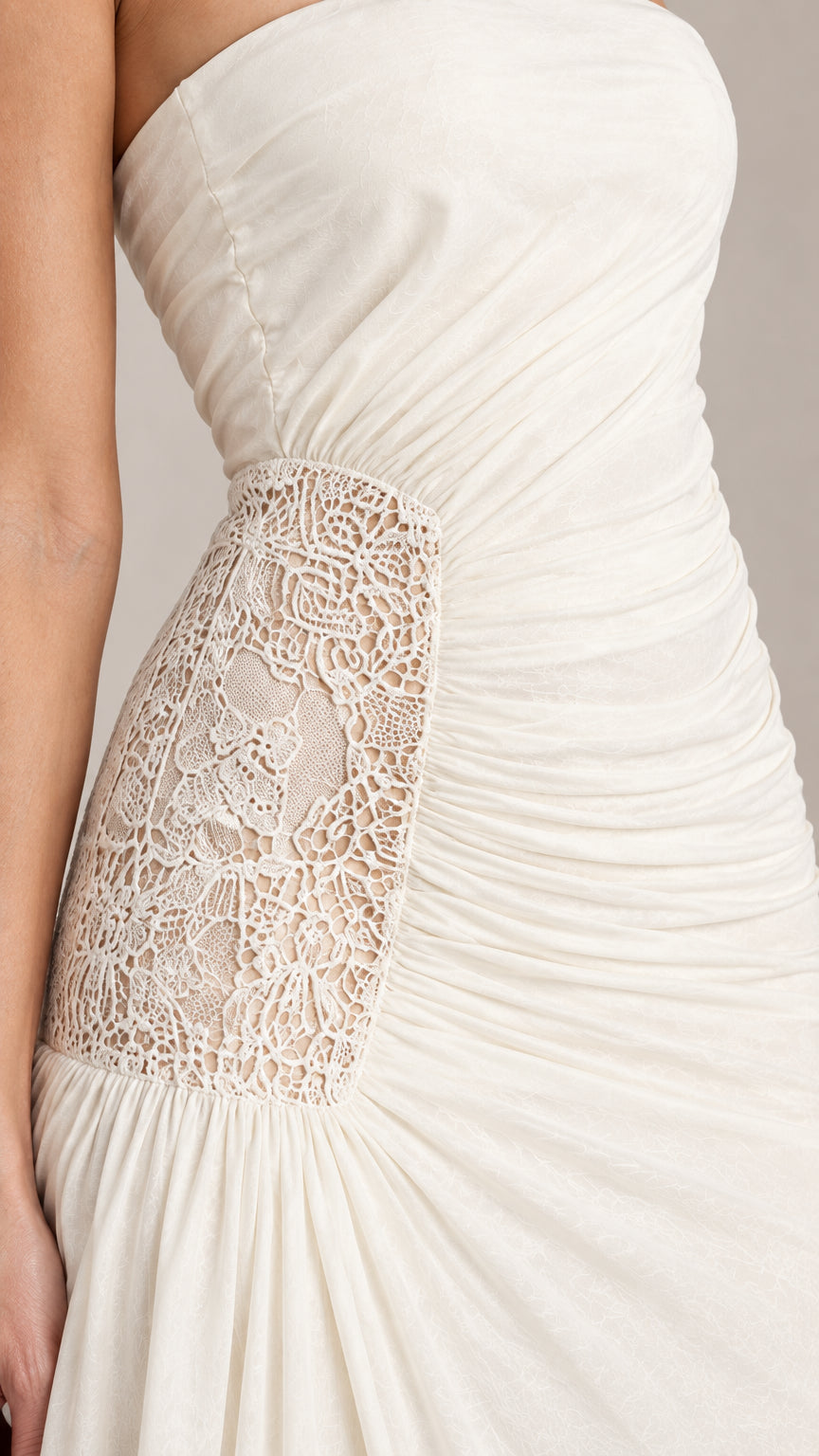 Close-up detail of delicate floral lace inset and waist ruching
