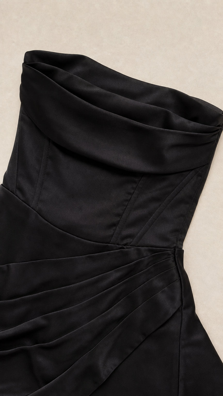 Close-up detail of structured corset seams and ruched satin foldover bust