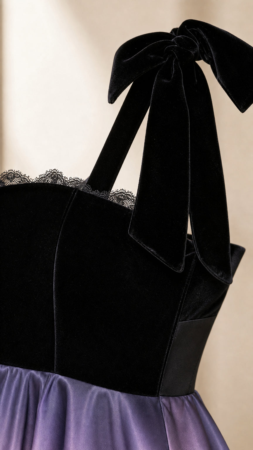 Close-up of the velvet-like bodice, scalloped neckline trim, bow strap, and lavender skirt