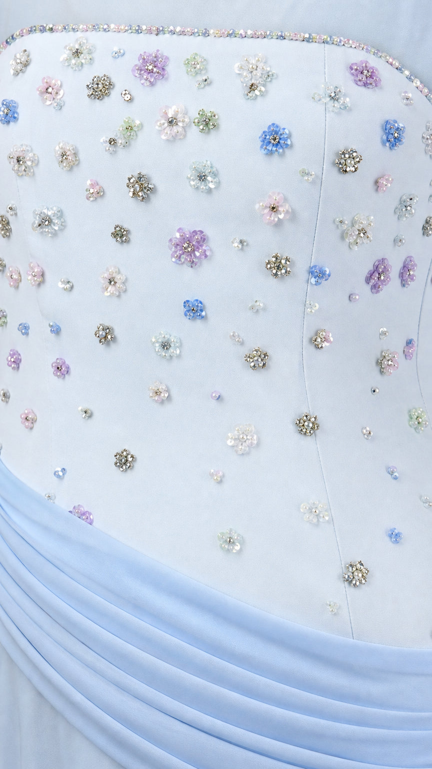 Close-up detail of delicate floral crystal beading and ruching on the sky blue bodice