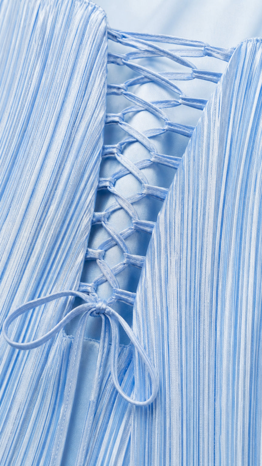 Close-up of sky blue lace-up back closure and fine pleated fringe texture