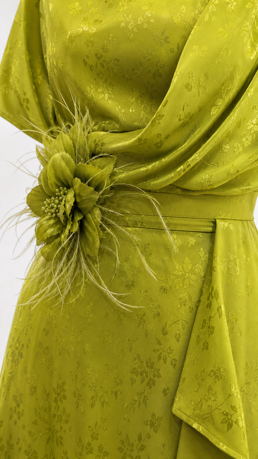Close-up of waist floral corsage appliqué and textured jacquard pattern