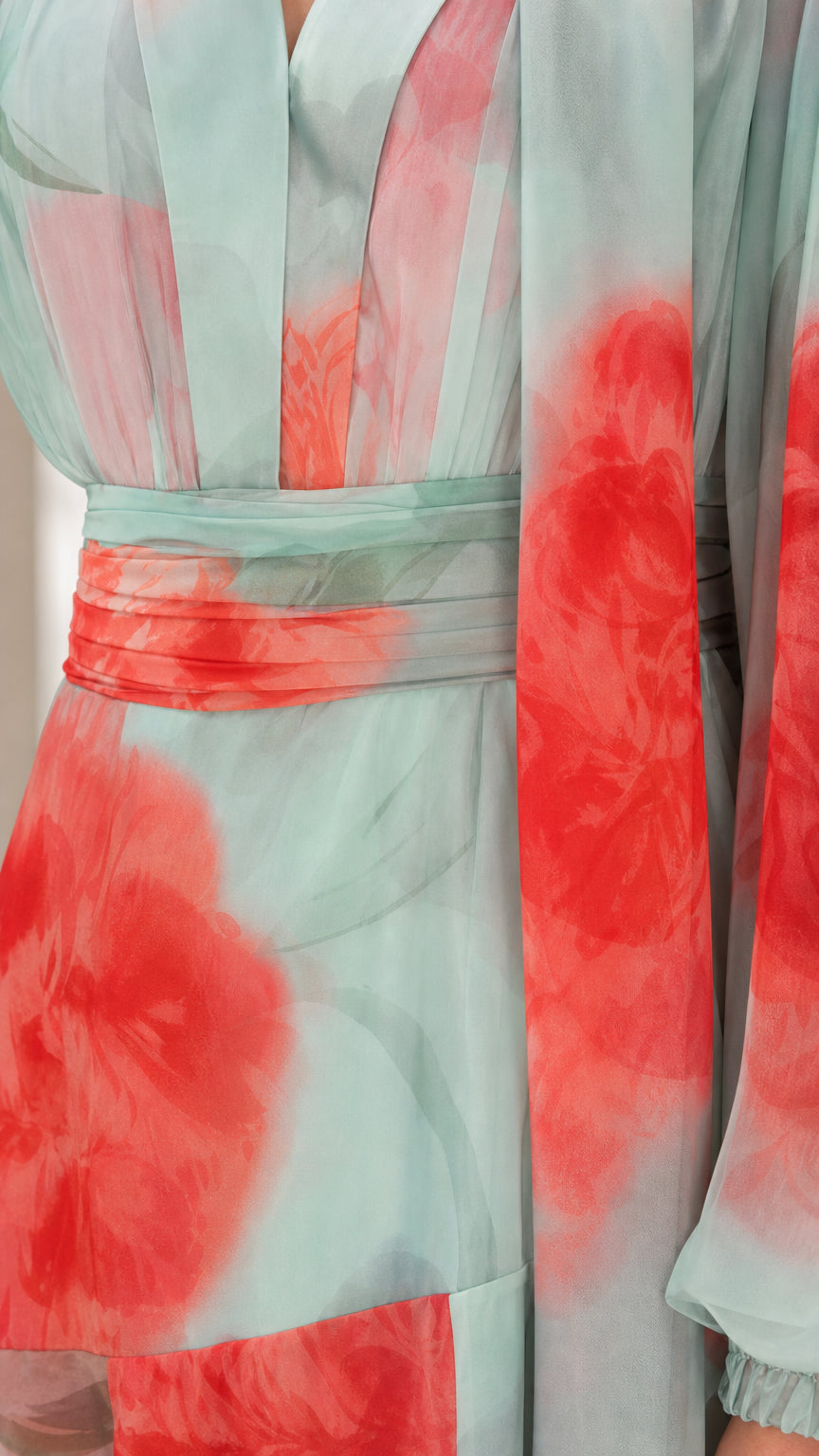 Close-up detail of pleated waistband and watercolor floral chiffon print