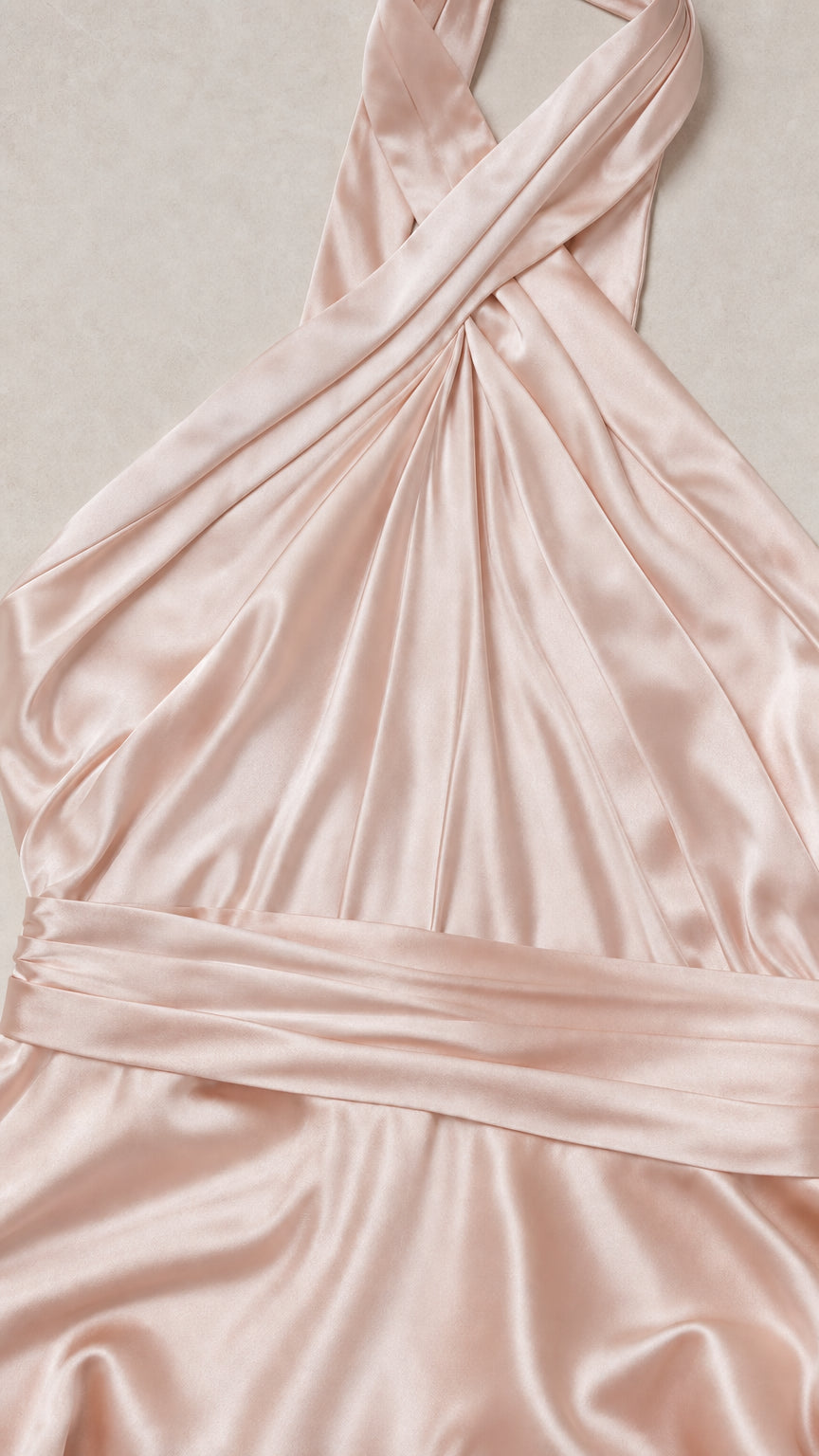 Close-up detail of criss-cross pleated halter neckline and waist in Blush Pink satin