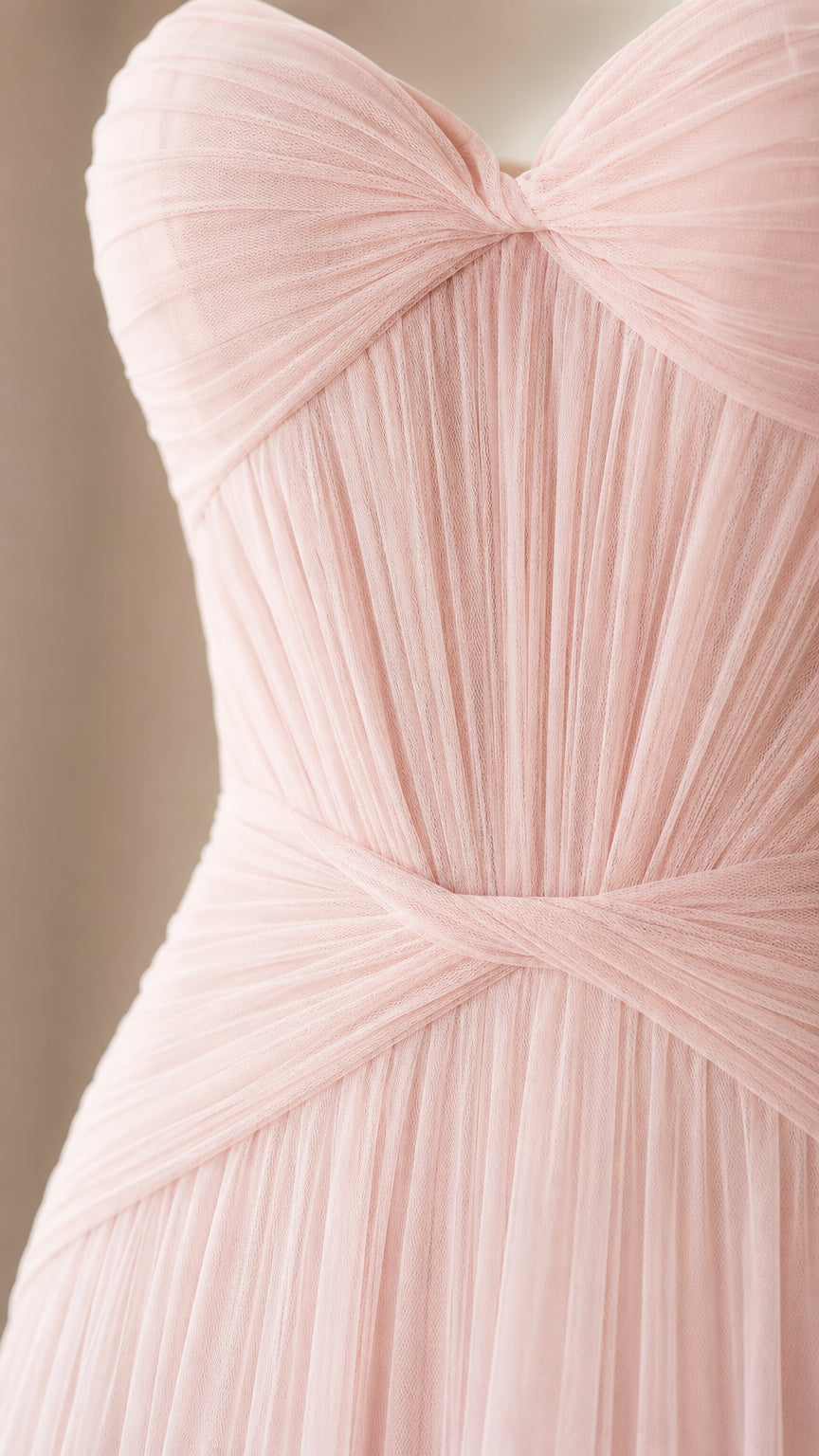 Close-up detail of pleated sweetheart bodice and crossover waist on Blush Pink gown