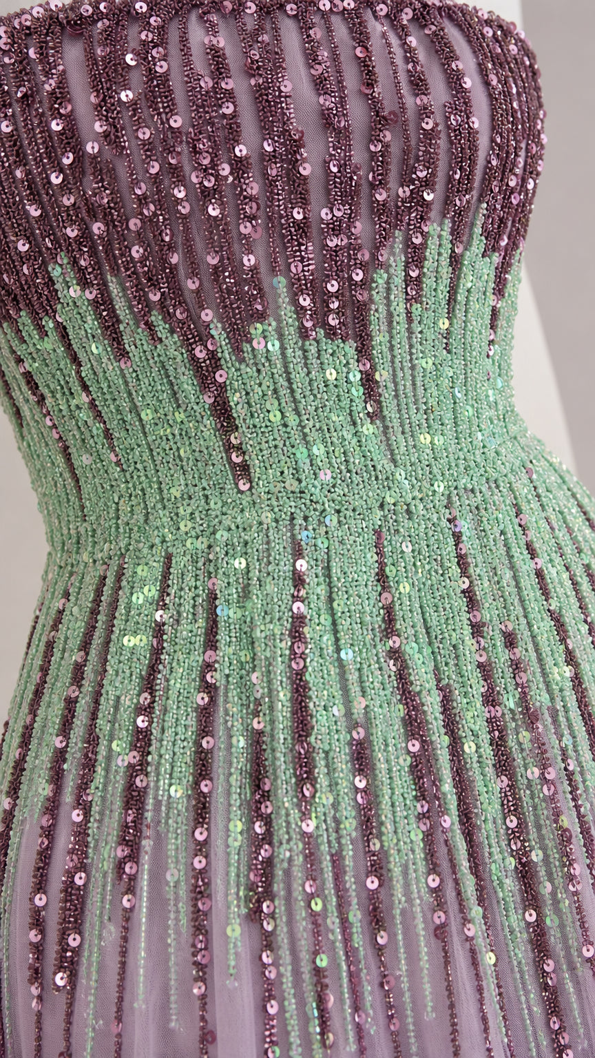 Close-up detail of sequin and bead pattern on gown