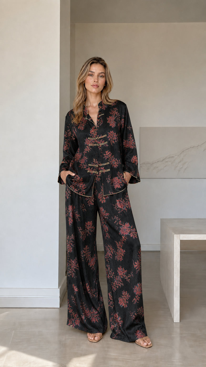 Model wearing black floral satin mandarin collar wide-leg pajama set