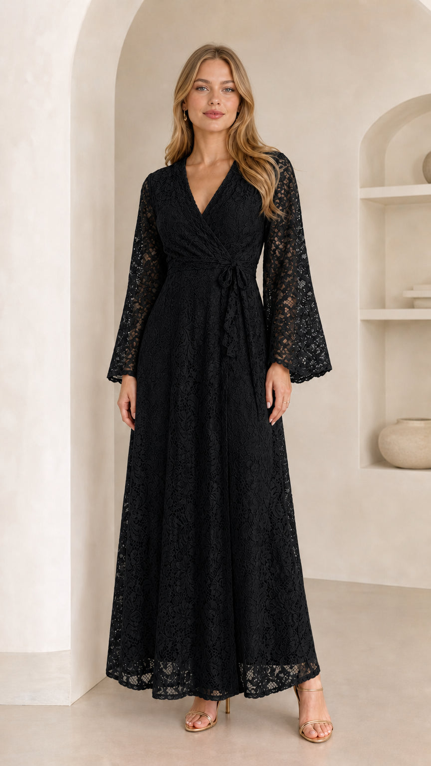 Front view of model wearing a black floral lace wrap maxi dress with bell sleeves