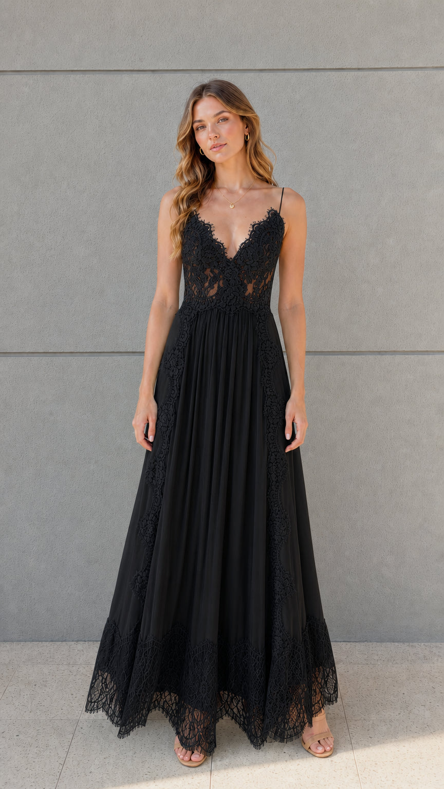 Full-length front view of black lace bodice pleated tulle maxi dress