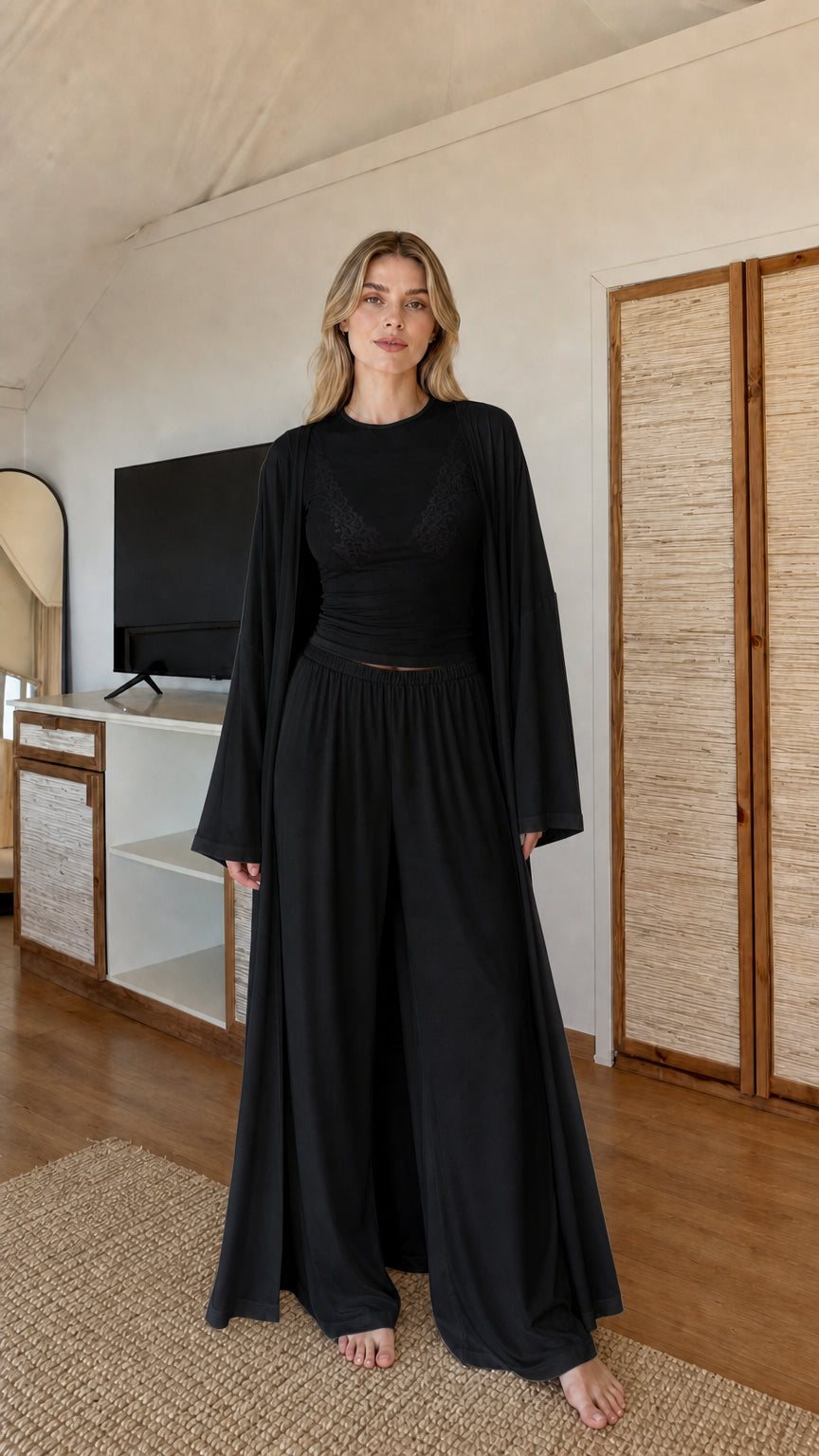 Front view of model wearing Black 3-piece cardigan and wide-leg palazzo lounge set