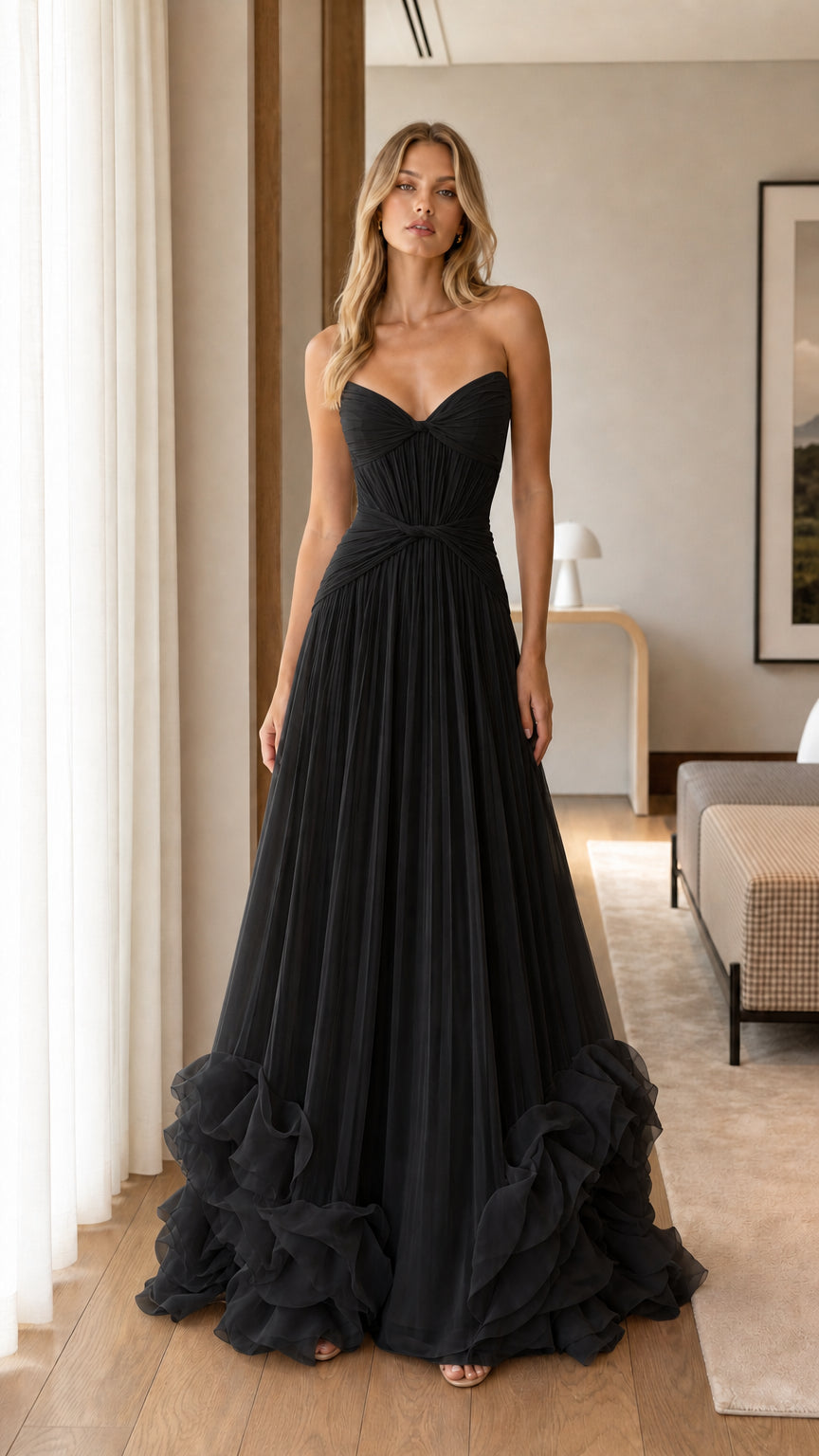 Model wearing Black strapless sweetheart pleated tulle formal gown
