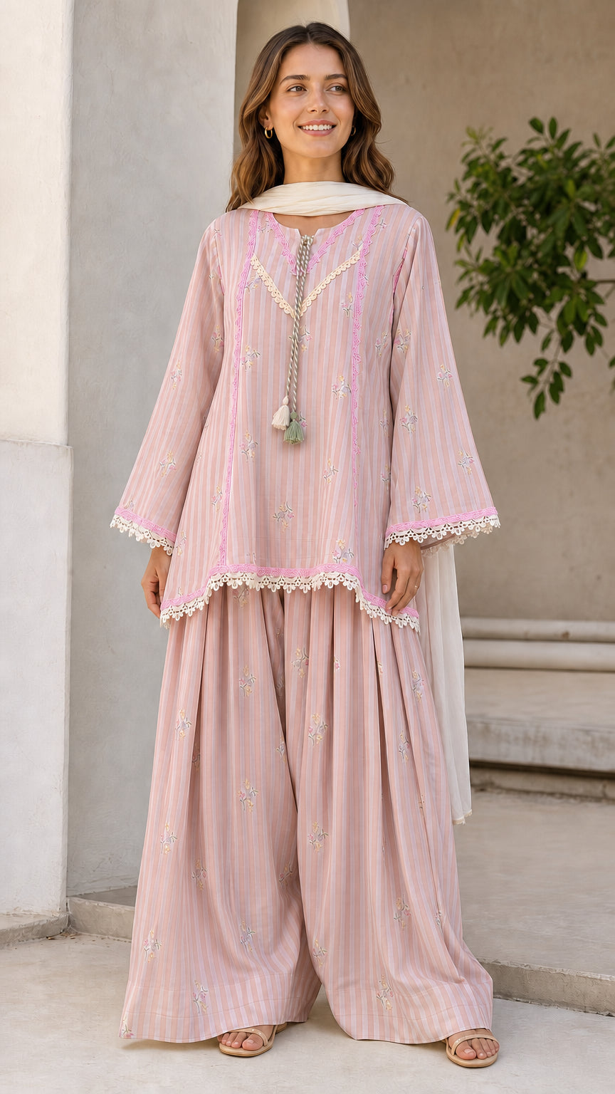Front view of woman wearing pink ethnic striped kurti and sharara set