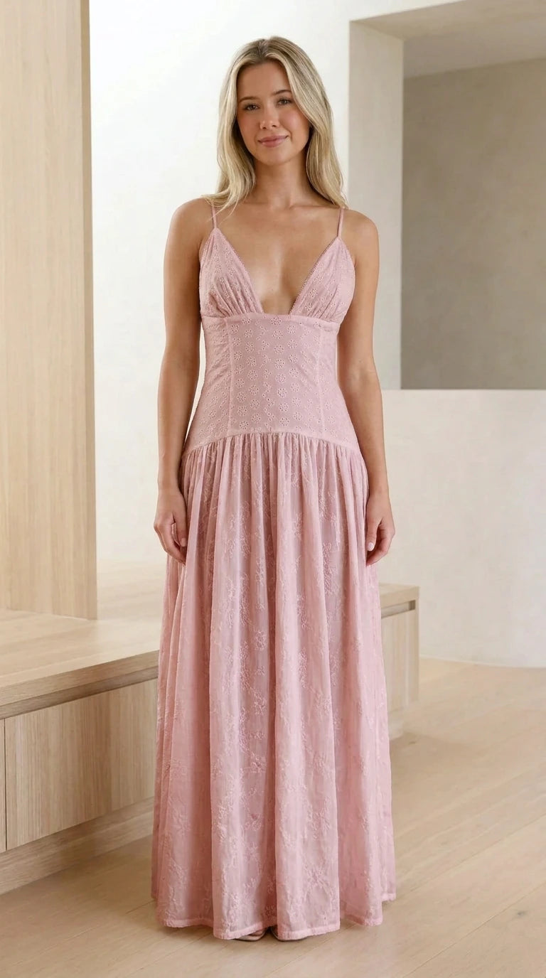 Model wearing dusty pink sleeveless drop-waist eyelet maxi dress
