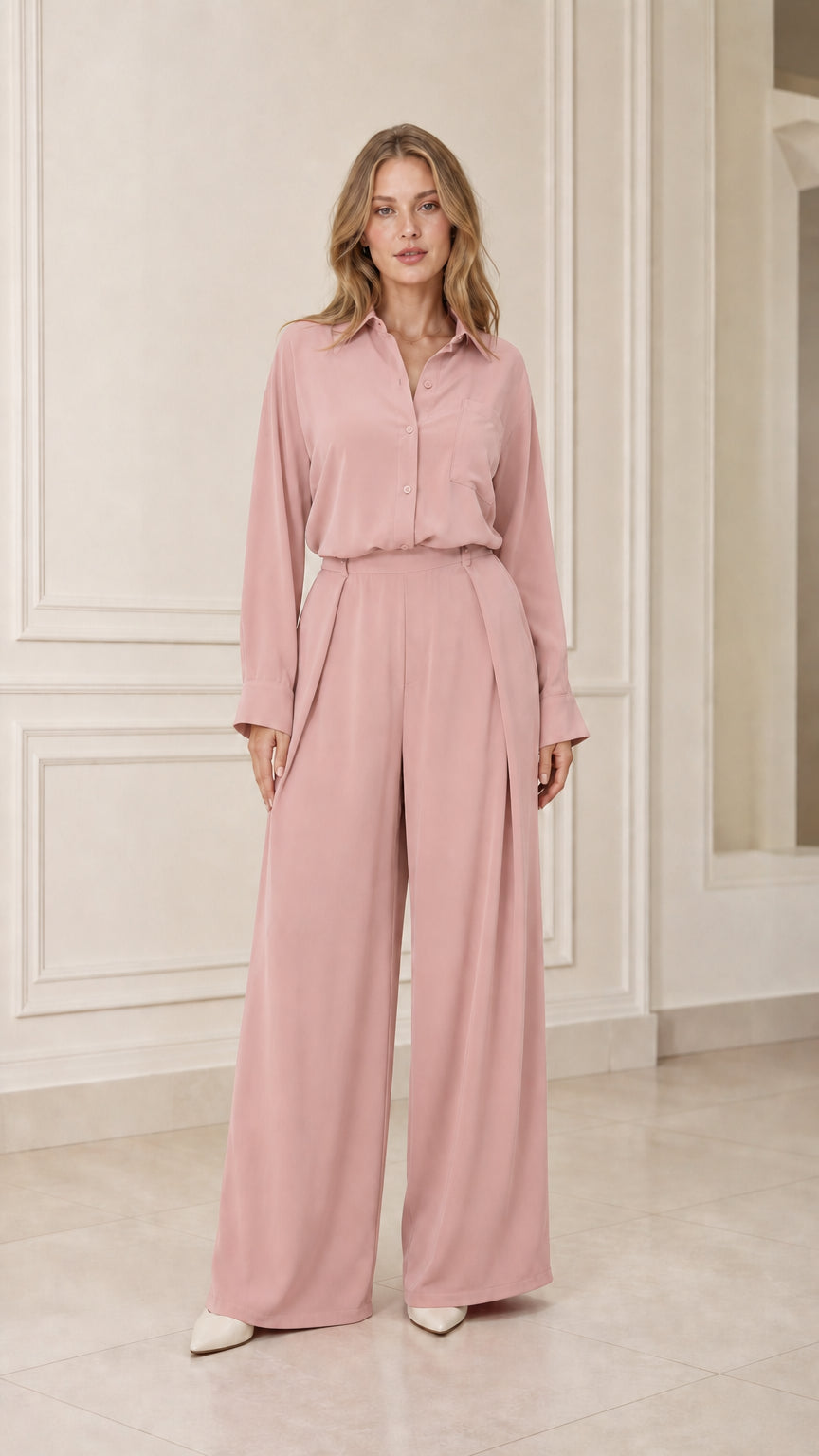 Model wearing pink long-sleeve shirt and wide-leg trousers set
