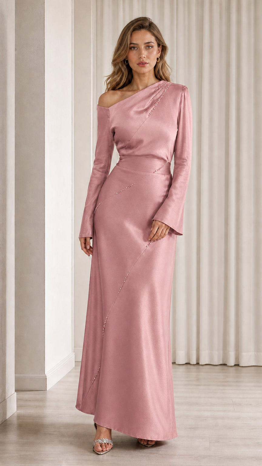Front view of model wearing pink one-shoulder satin gown